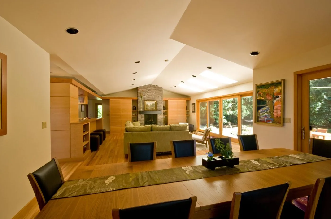 Open-concept living room with custom cabinetry around a fireplace